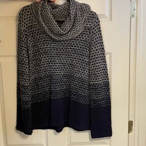 This is a beautiful and comfortable sweater. Very lightly worn.